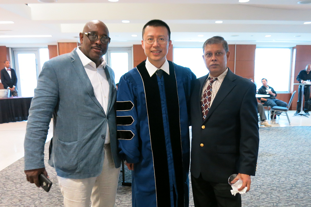 (left to right) David Harrington, Quan Zou, Tapan Nayak at an alumni event.
