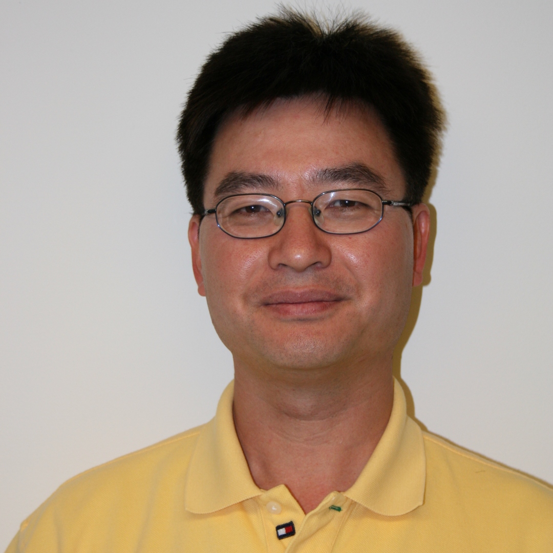 Statistics PhD Program Director, Feifang Hu, in a yellow shirt