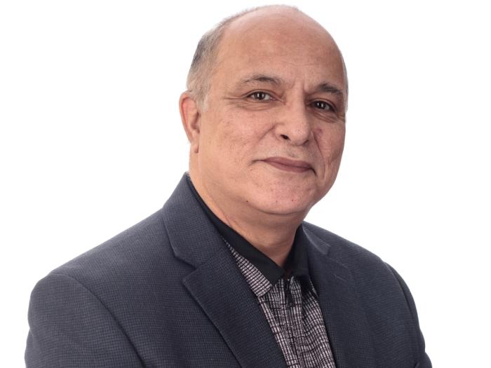 Statistics MS Program Director, Reza Modarres, in a gray suit jacket